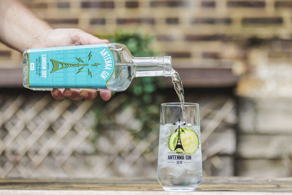 Antenna London Dry Gin being poured in to Antenna branded glass.