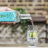 Antenna London Dry Gin being poured in to Antenna branded glass.
